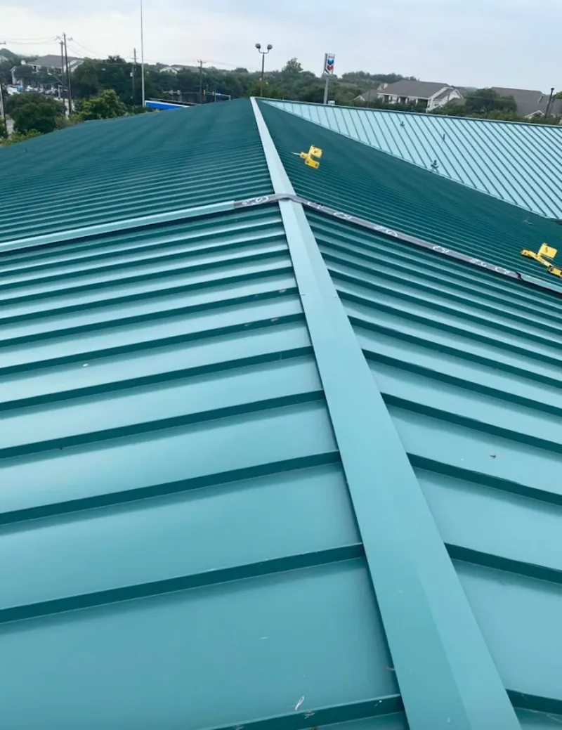 Green commercial metal roof ridge and valley for Metal Roof Repair in Creston